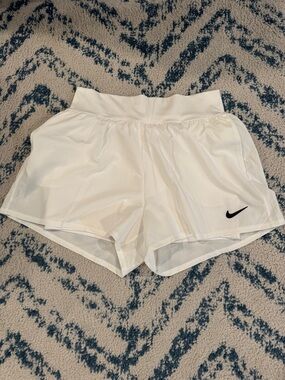 NIKE White Women's Running Shorts with Black Swoosh